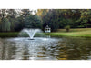 Solar DA-20 Pond Aerator with a gazebo and trees in the background