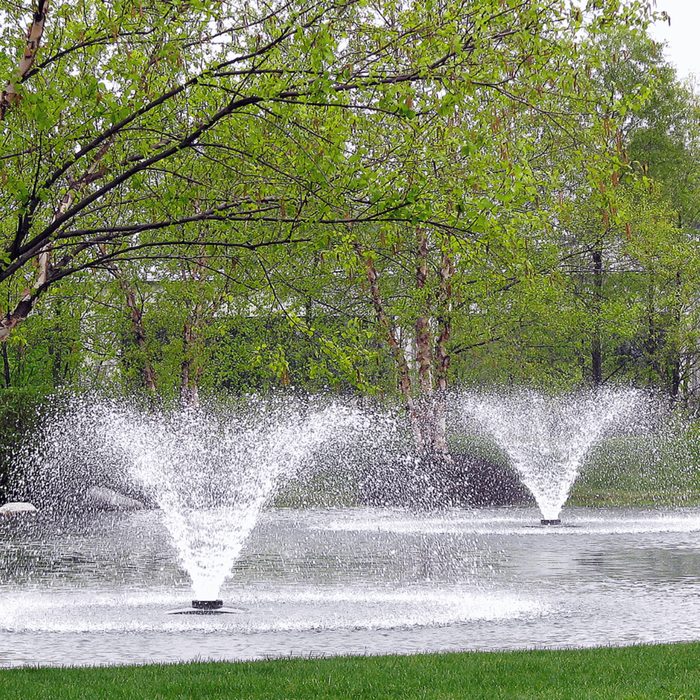 Two Scott Aerator Solar DA-20 3/4 HP fountains running side by side