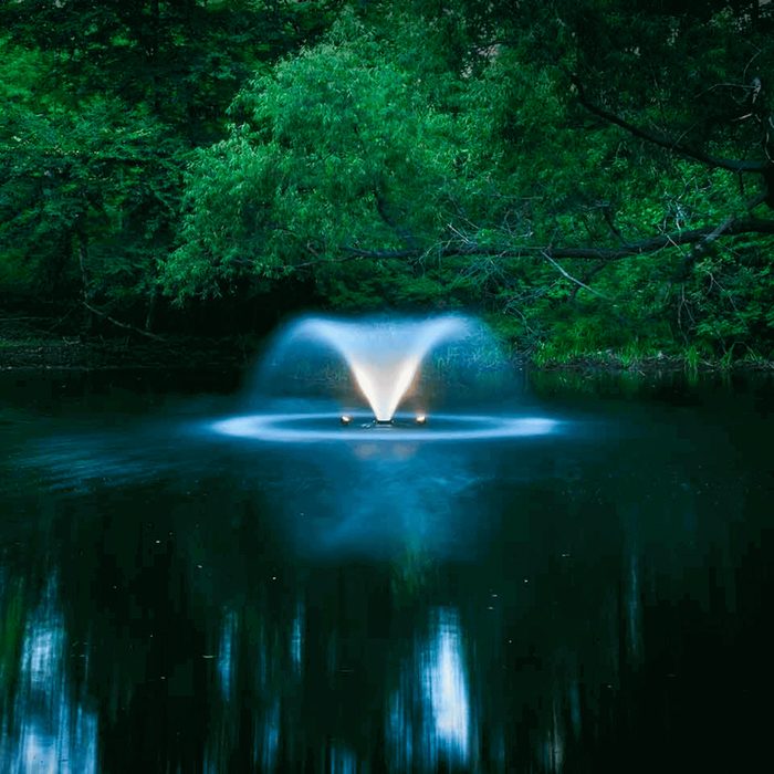 Scott Aerator Solar DA-20 with LED lights reflecting on the pond at night