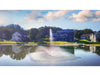 Scott Aerator Solar Skyward Fountain in a residential pond with houses in the background