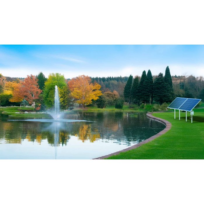 Scott Aerator Solar Skyward Fountain in a pond with autumn trees and solar panel array