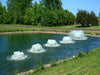 Surface Aerator Multiple Aerators on Water with Trees at the Background
