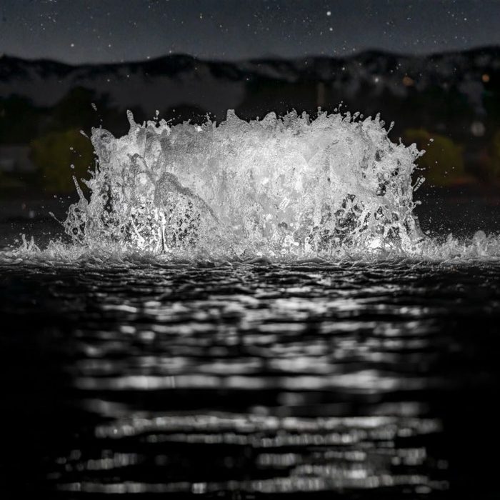 Surface Aerator with bright white LED lighting in pond at night