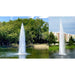 Vertex GeyserJet commercial pond fountain spraying a tall white column of water in a park setting