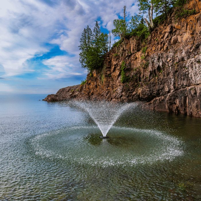 VFX Series fountain spraying on the water under a cloudy sky