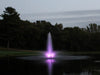 WaterGlow RGB LED illuminating a vertical pond fountain with purple light during dusk