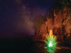 WaterGlow RGB LED Lighting illuminating a decorative pond fountain with multicolor display under a starry night sky